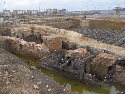 Storehouse foundations with the timber slipways behind. J. D. Davies.
